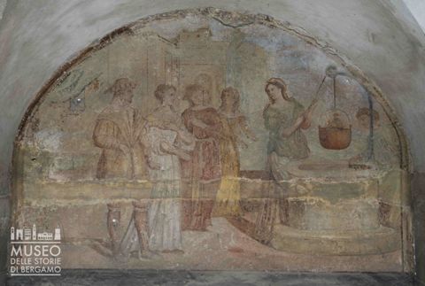 Alcune figure attingono acqua da un pozzo